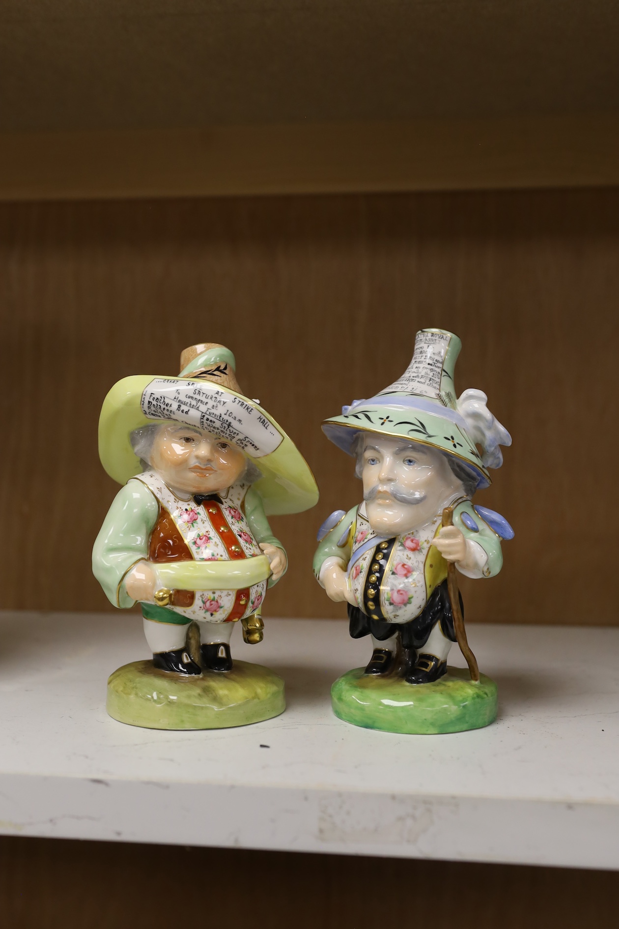 A pair of Derby Sampson Hancock Mansion House dwarves, late 19th century, tallest 18.5cm high. Condition - good